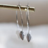 Small silver feather hoops 9